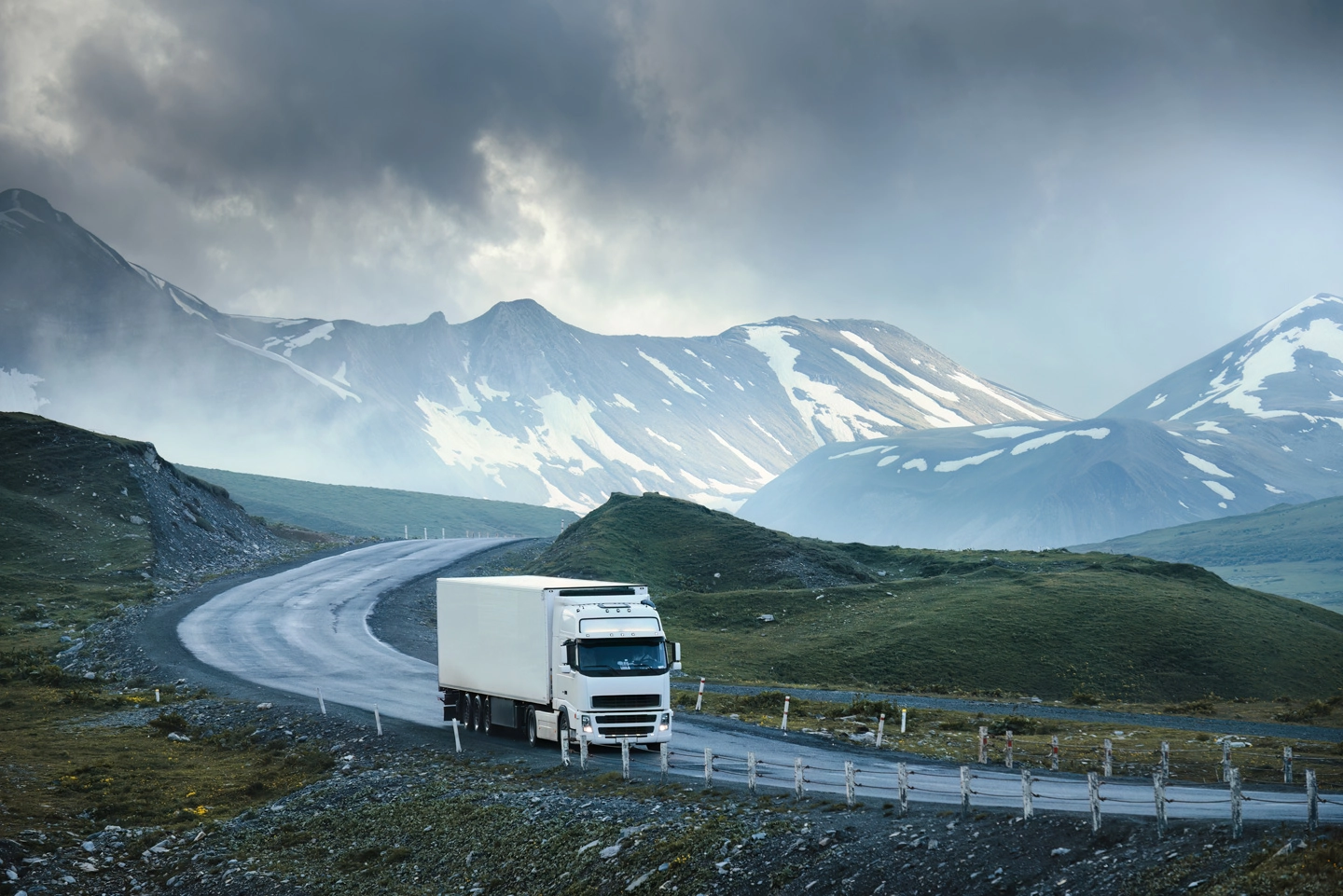 truck driving on a mountain road 