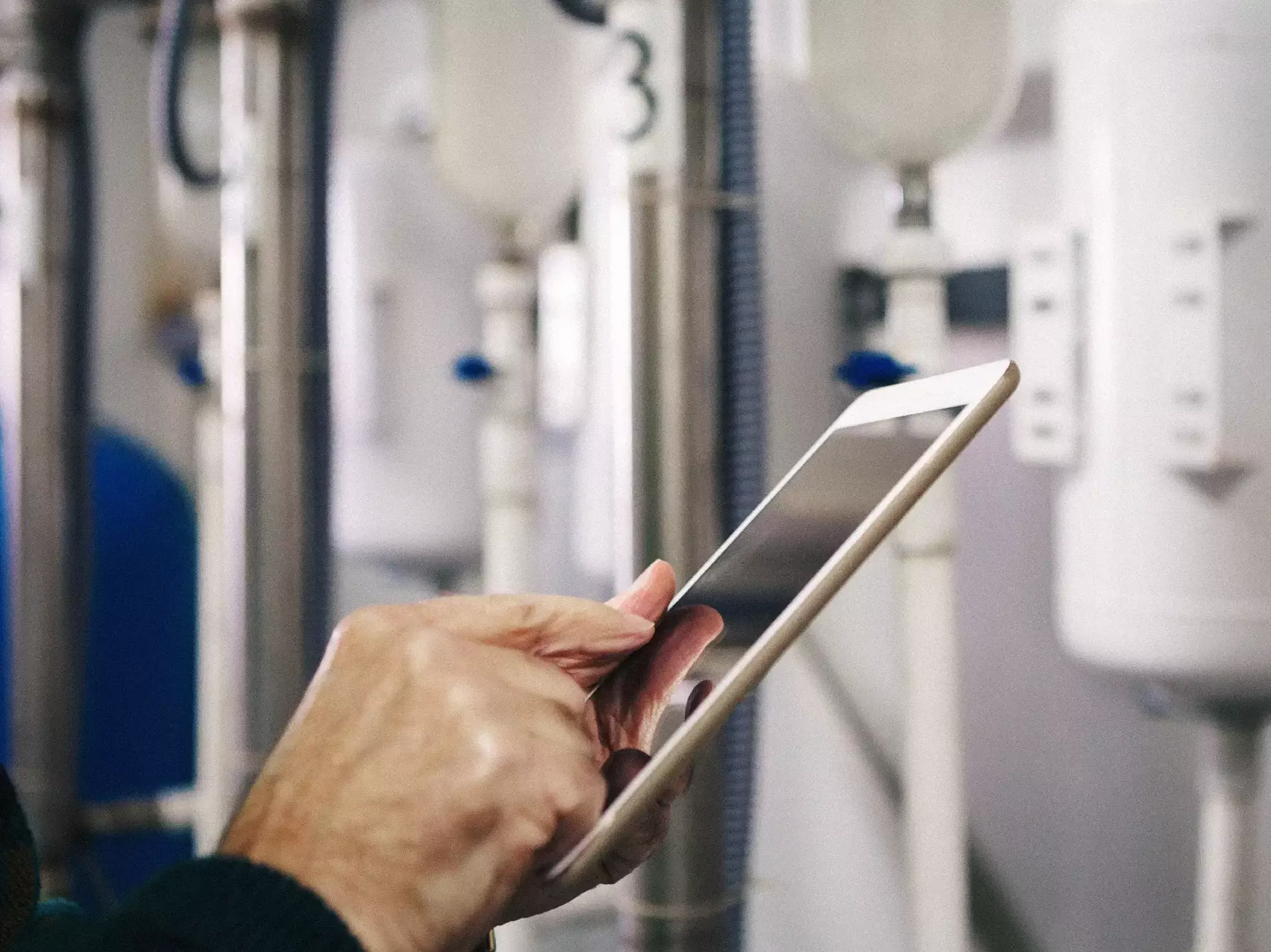 Worker checking information on tablet device