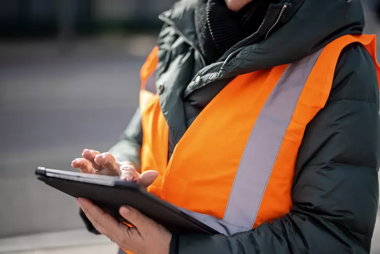 Close up of a commercial dock manager using digital tablet Close up of a commercial dock manager using digital tablet