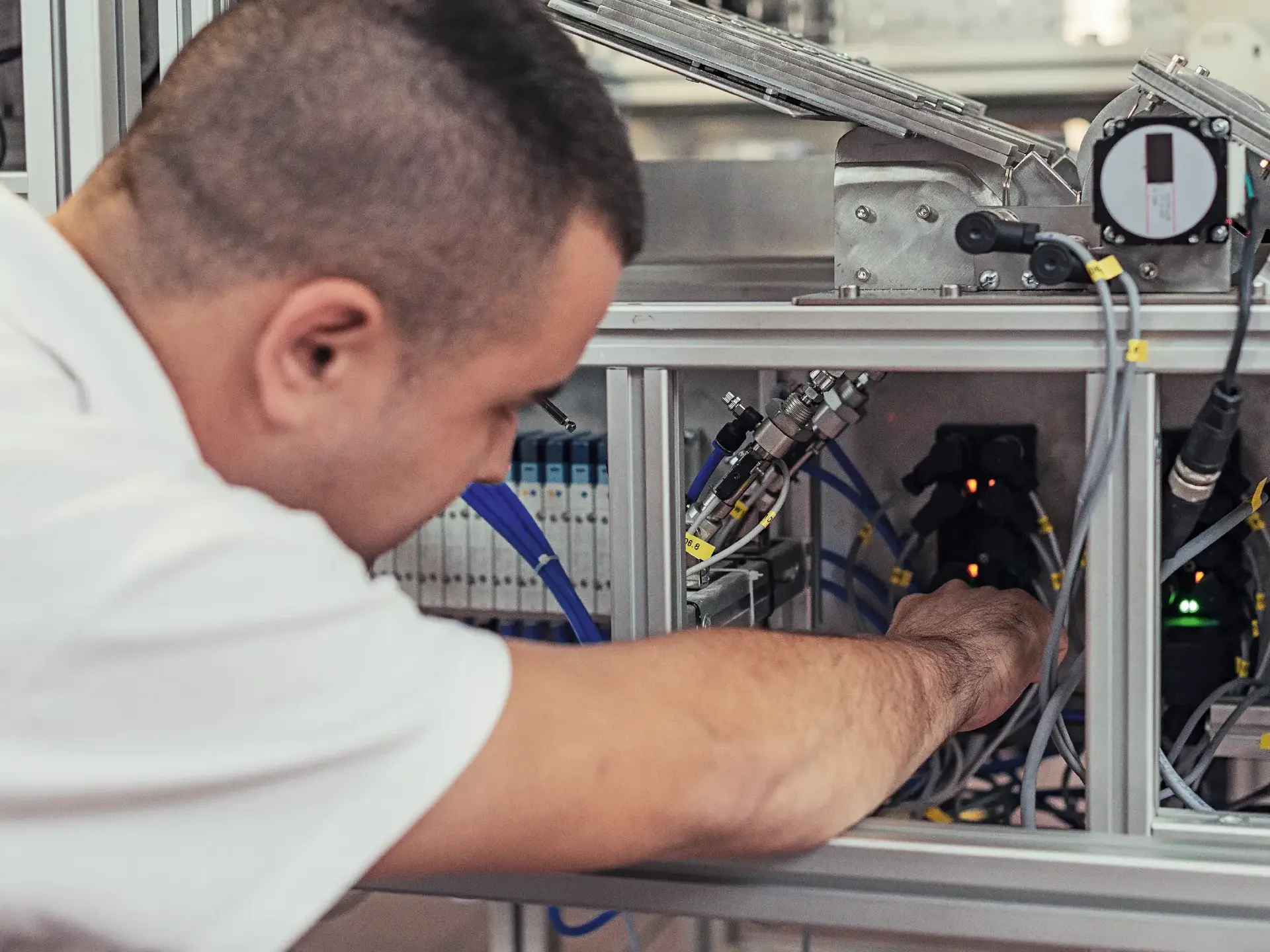 Repairman working with broken production line machine Repairman working with broken production line machine